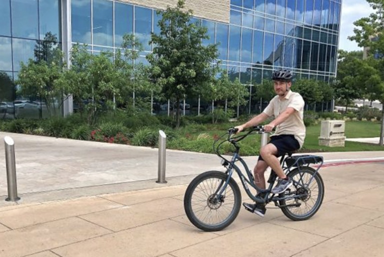 man riding e-bike