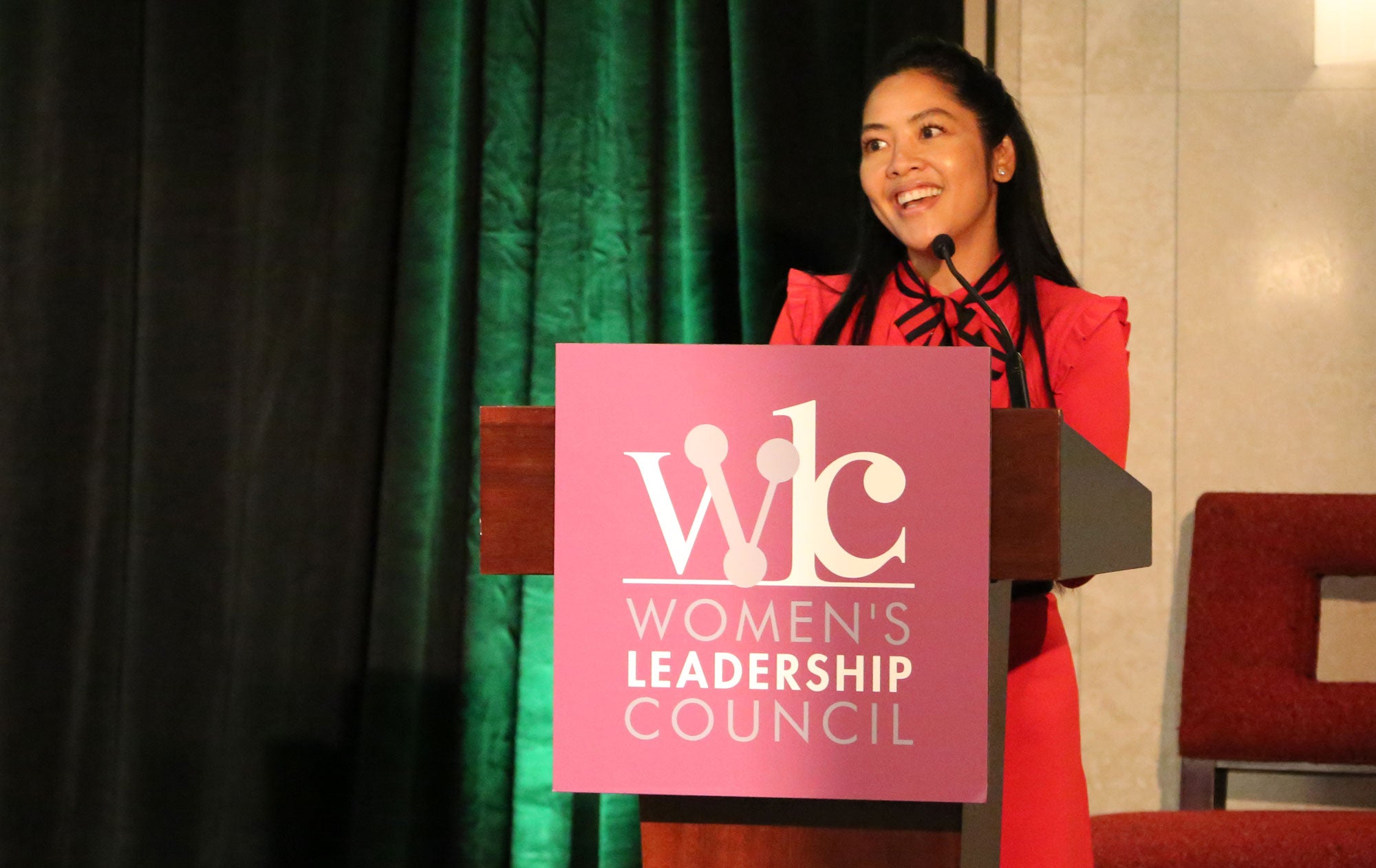 Philana presents to attendees at the inaugural Women's Leadership Council Conference in 2017.